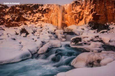 The stunning Oxararfoss waterfall is nestled in a valley of Thingvellir National Park on Iceland's Golden Circle.