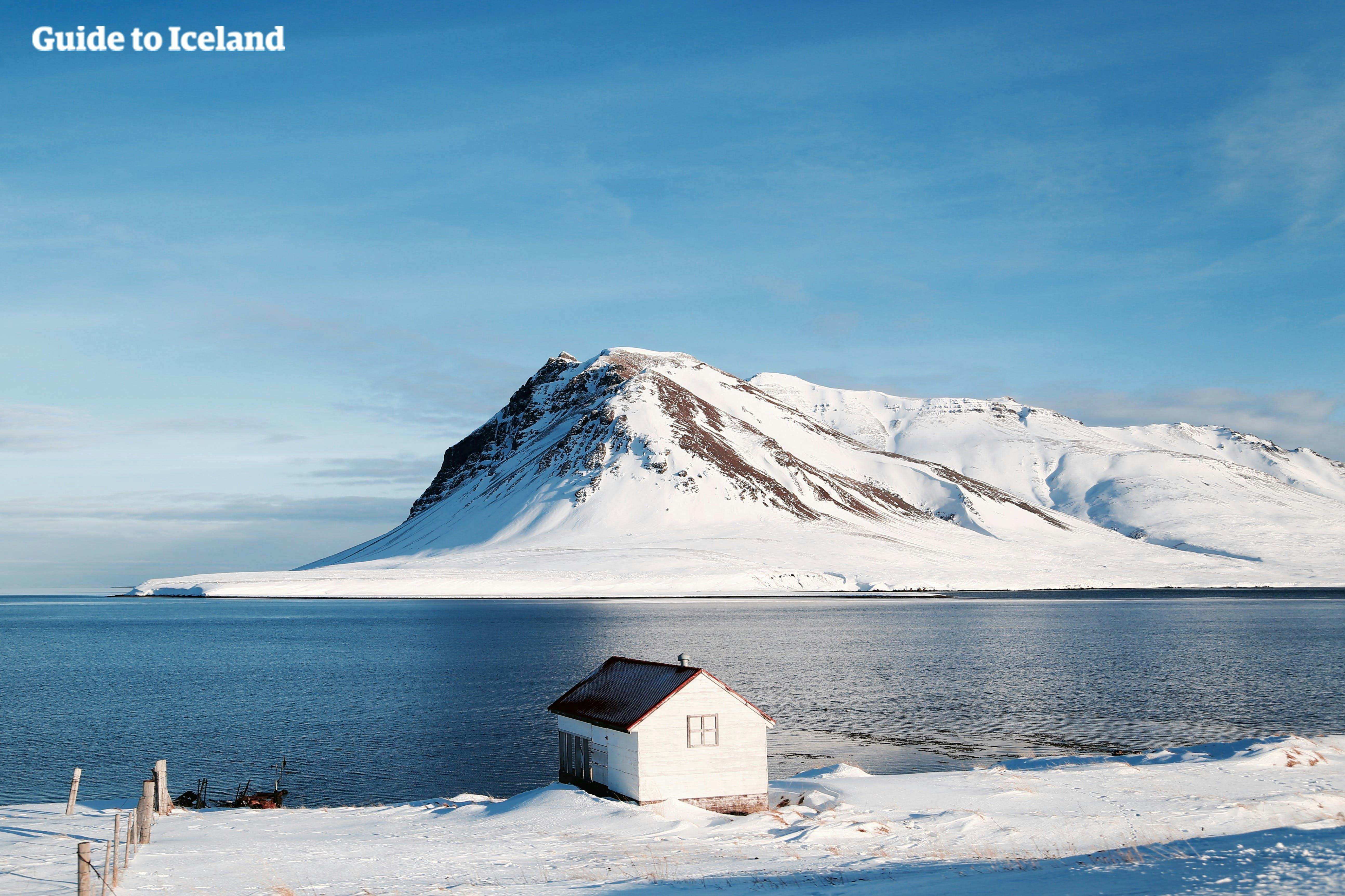 A house overlooks a stunning seascape in West Iceland.