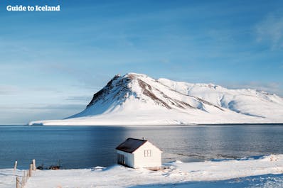 A house overlooks a stunning seascape in West Iceland.