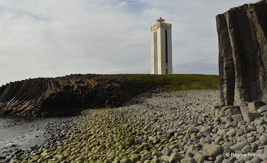Kálfshamarsvík beach in Iceland has basalt columns and a lighthouse.