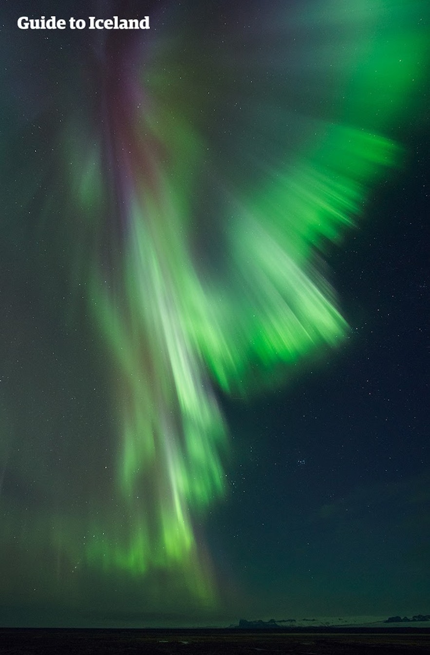 The aurora borealis descend over East Iceland.
