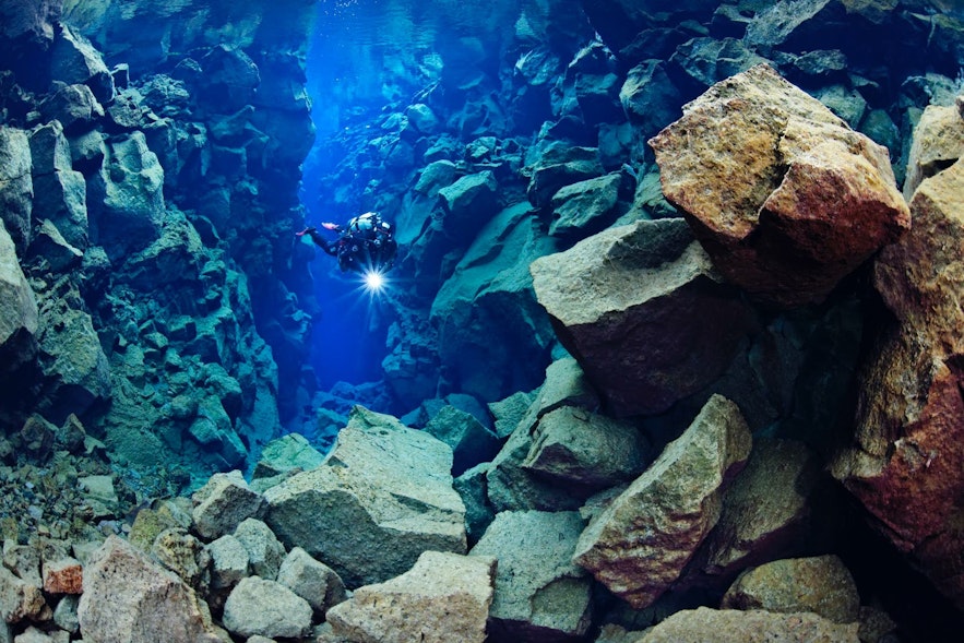A scuba diver in Silfra Hall.