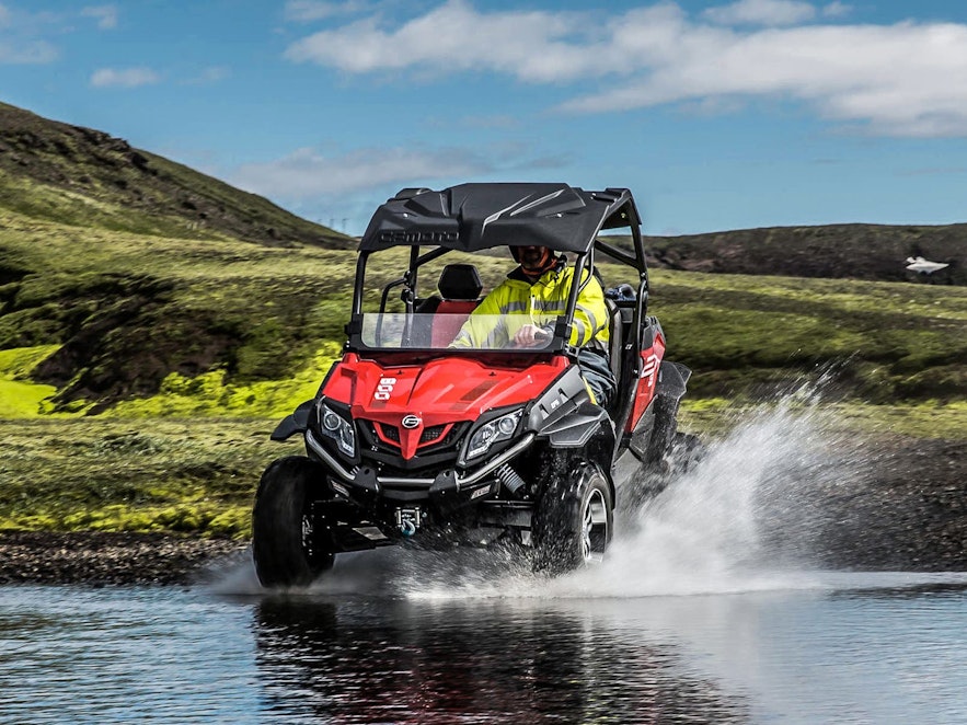 A buggy enters a river in Iceland.