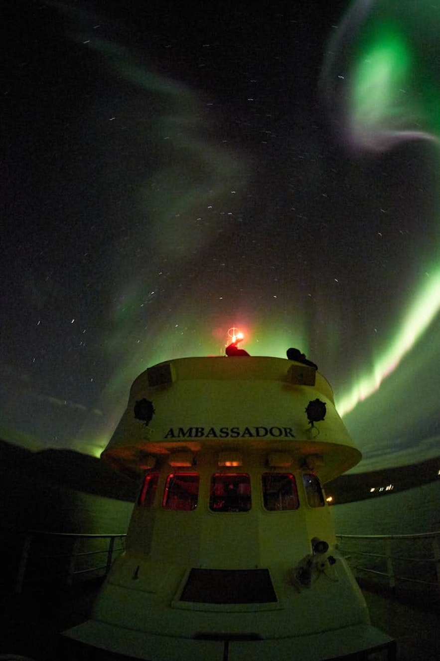 Boats allow you to see the auroras from a stunning vantage point.