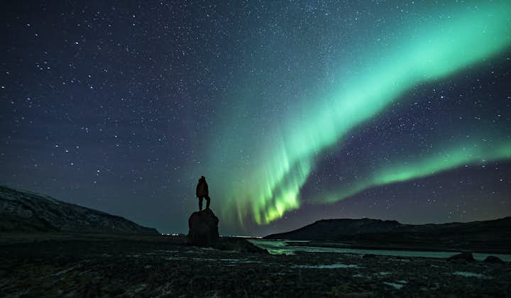 A traveler marvels over the Northern Lights in Iceland.