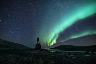 A traveler marvels over the Northern Lights in Iceland.