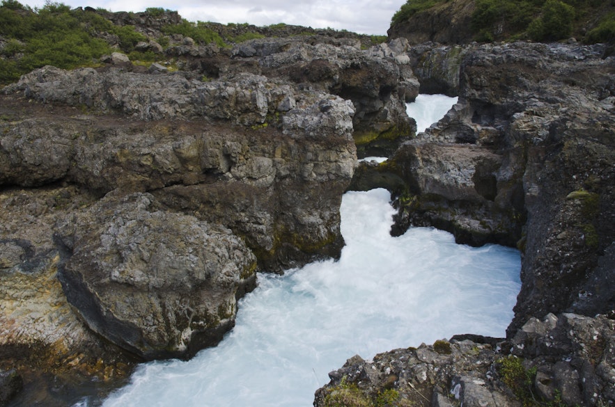 Barnafoss is a surging waterfall in Iceland's west.
