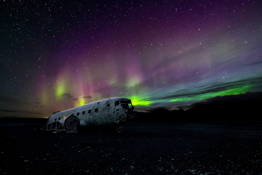 The DC-3 wreck under the Northern Lights.