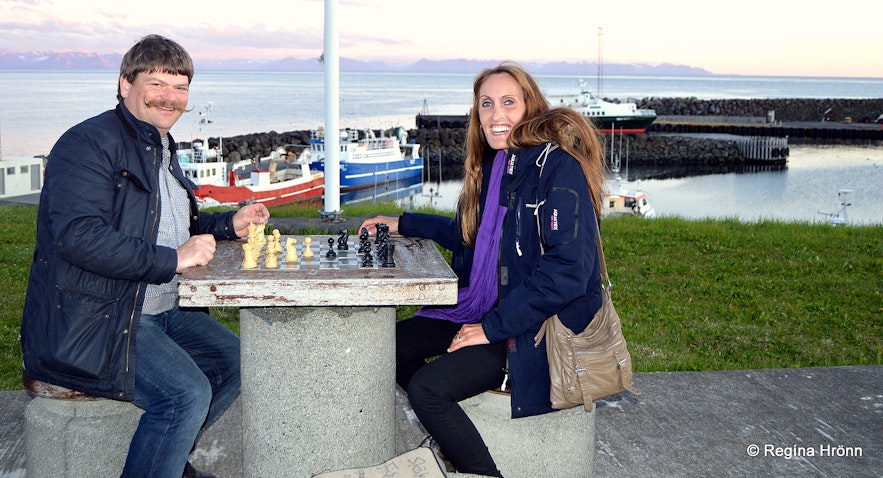 Playing chess by the outside chessboard at Grímsey
