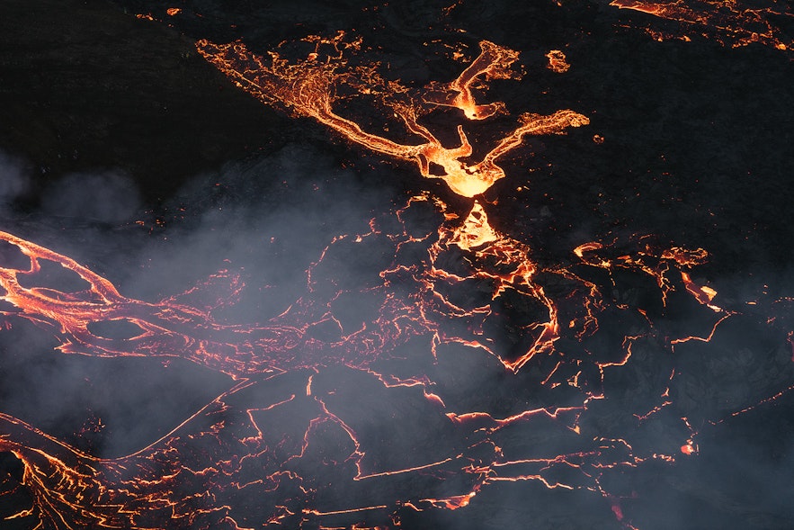 A night time view of the lava rivers of Fagradalsfjall volcano.