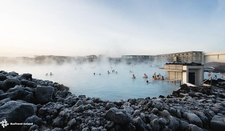 People are soaking in the geothermally heated waters of the world-famous Blue Lagoon in Iceland.