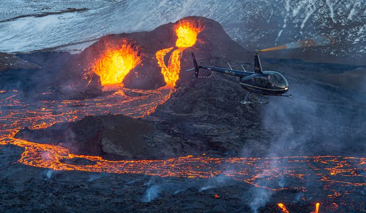 A helicopter soars over Iceland's ongoing eruption.