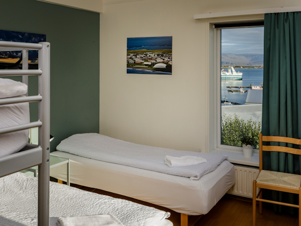 Akranes HI Hostel's rooms are brightly furnished.