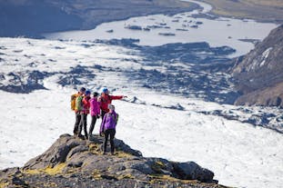 A group of hikers stops to admire the breathtaking views across the Solheimajokull and Myrdalsjokull glaciers.