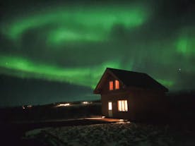 The Greystone Cottages under the Northern Lights.