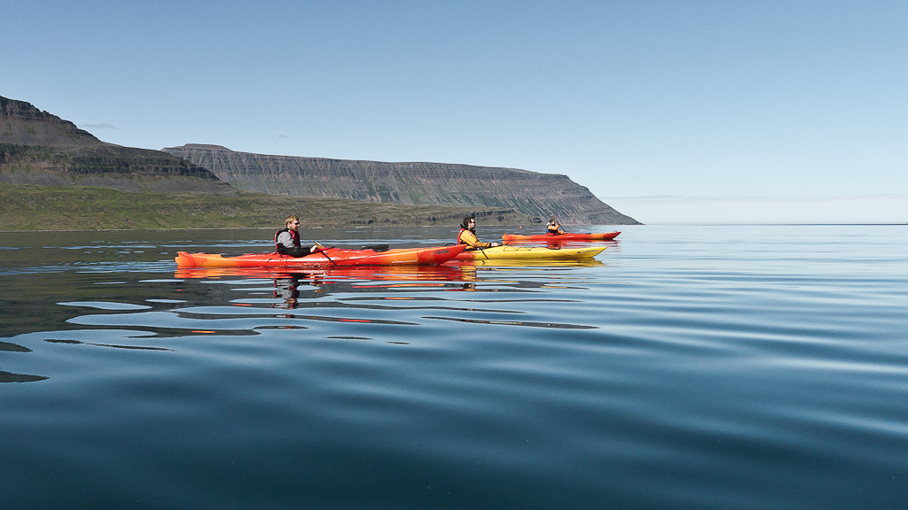 Kayakers enjoy a lovely adventure in the Westfjords.