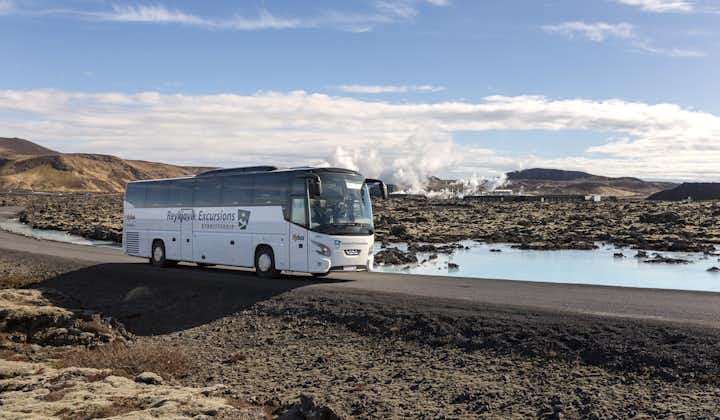 A tour bus arrives at the Blue Lagoon.