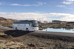 A tour bus arrives at the Blue Lagoon.