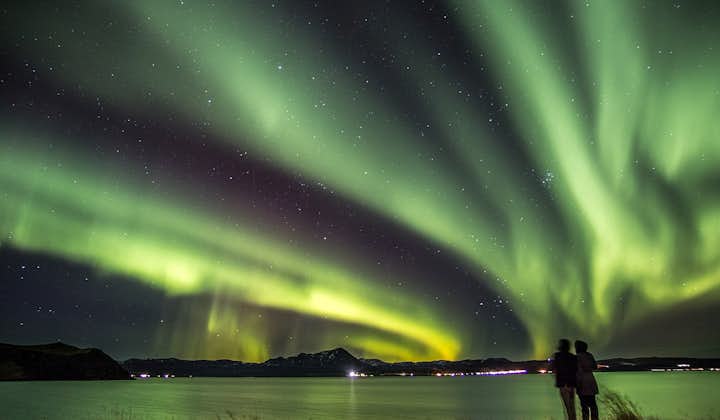 Green northern lights radiating over Lake Myvatn