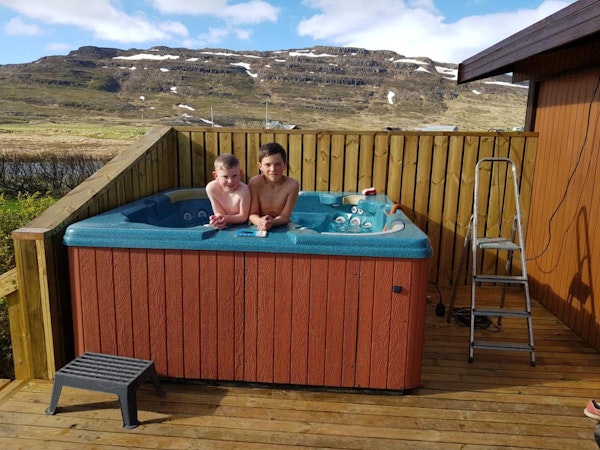 Kids splash in the waters of the hot tub of the Hammer Cottages.