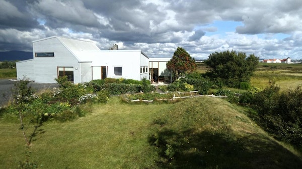Eyvindarholt Guesthouse on a sunny day.