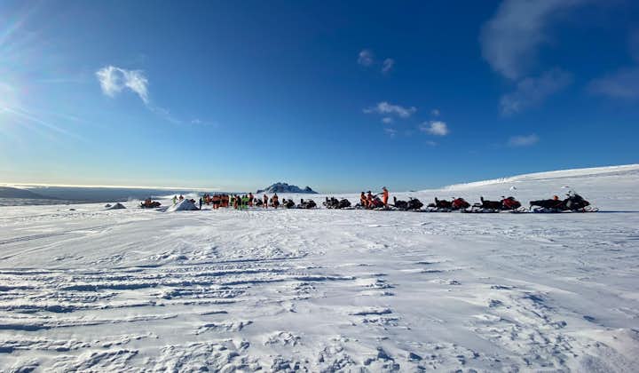 Snowmobiles lined up on Langjokull glacier.