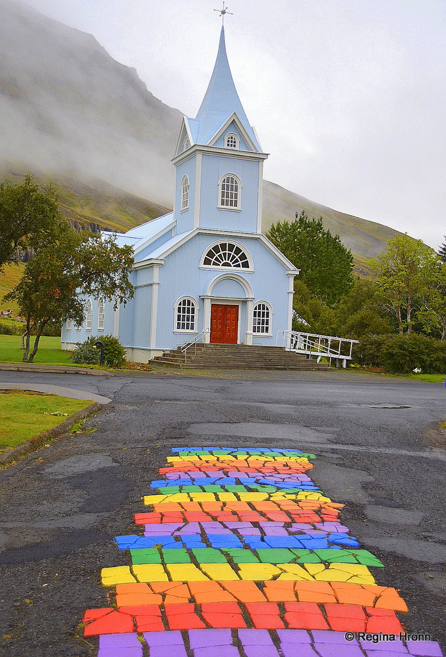 The rainbow street in Seyðisfjörður and the blue church