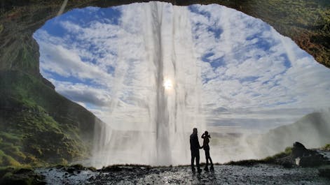 Seljalandsfoss waterfall on the South Coast of Iceland can be walked behind during the summer season.
