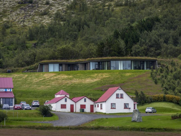 Klettasel, a building set into the hillside overlooking the village of Hof in Southeast Iceland.