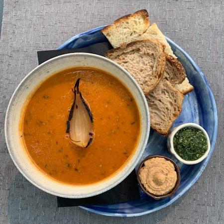 Soup with bread, hummus, and pesto on the side at Hotel Skalholt’s restaurant.