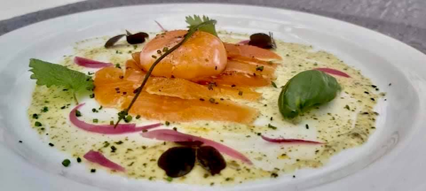 Close-up view of a beautifully presented salmon dish at Hotel Skalholt’s restaurant.