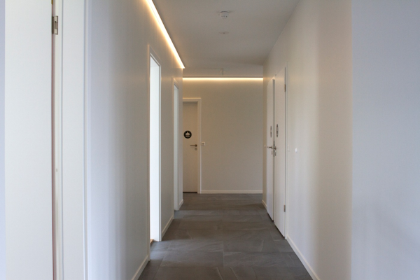 View down the corridor at Graystone Guesthouse, doors can be seen on each side.