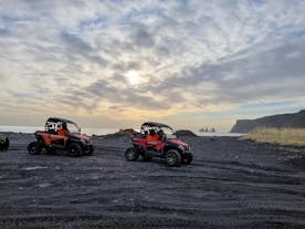 Two buggies on a black beach in Vik.