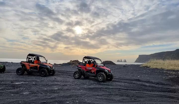 Two buggies on a black beach in Vik.