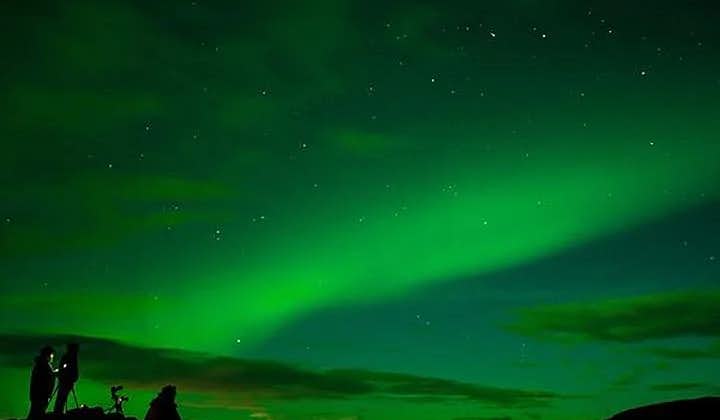 A deep green wave of northern lights above Iceland.