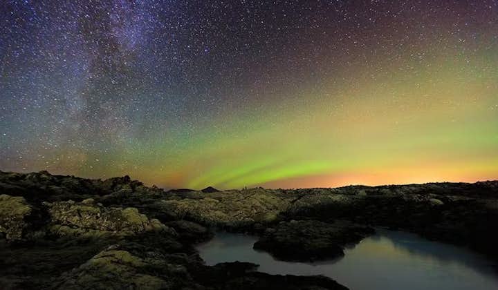The starry night sky giving way to the bright colors of the aurora borealis.