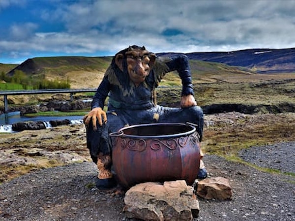 A troll with a pot on the landscape surrounding Fossatun Country Hotel.
