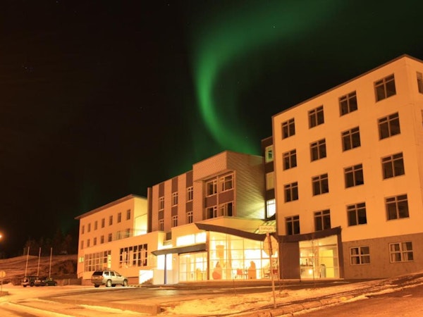 Hotel Borgarnes front view with northern lights.