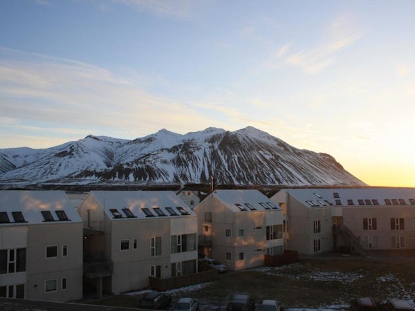 Hotel Borgarnes with view of snow-covered Hafnarfjall mountain.