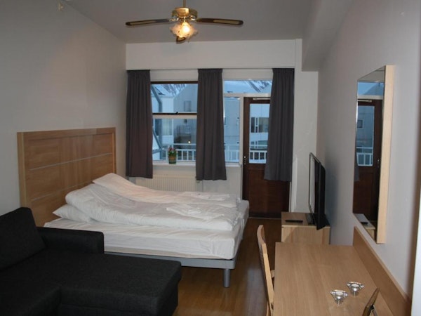 Hotel Borgarnes room with balcony and view of fjord.