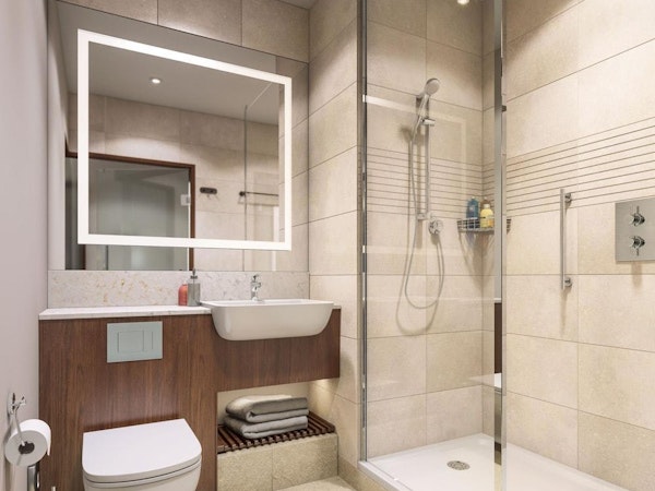 A bathroom with a shower, toilet, toiletries, mirror, and towels at the Courtyard by Marriott Reykjavik Keflavik Airport.