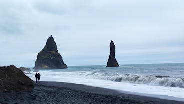 Jet-black sands and basalt columns on Reynisfjara black sand beach.
