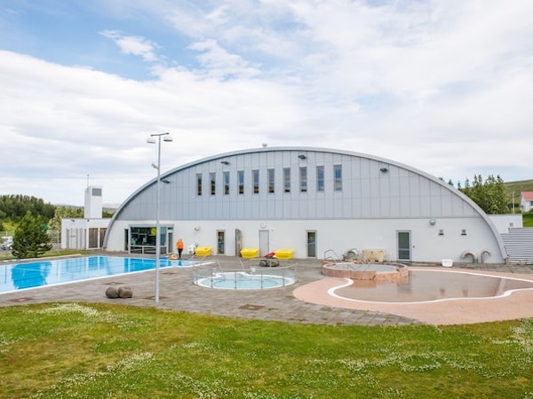 The Sundlaug Laugum geothermal swimming pool facility nearby Hotel Laugar Reykjadalur includes a large outdoor pool and smaller 
