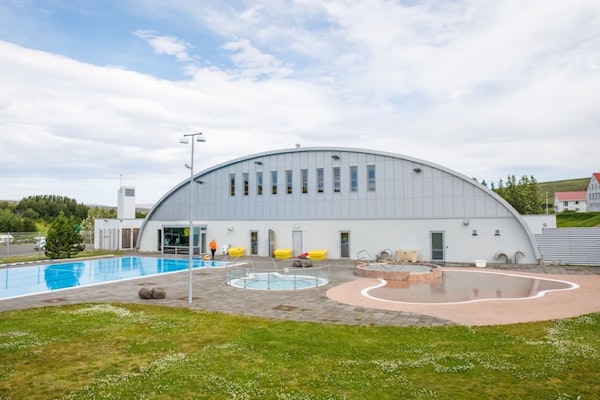 The Sundlaug Laugum geothermal swimming pool facility nearby Hotel Laugar Reykjadalur includes a large outdoor pool and smaller 