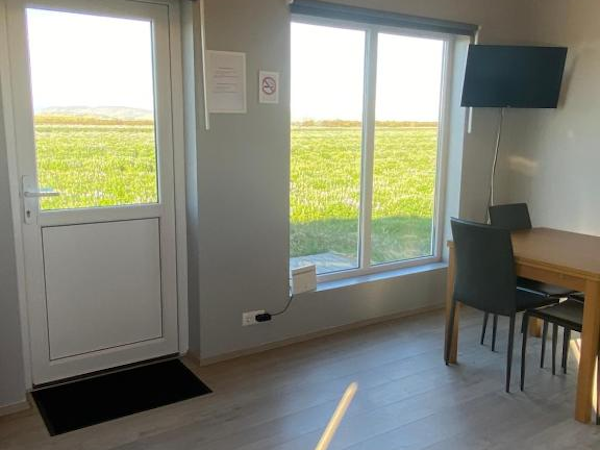 The living space has large windows to enjoy the view of the river Thvera nearby.