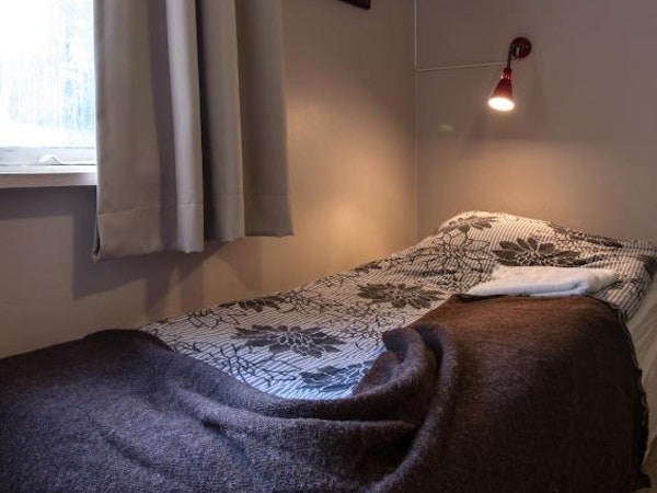 Comfortable beds await travelers at Hotel Hjardarbol.