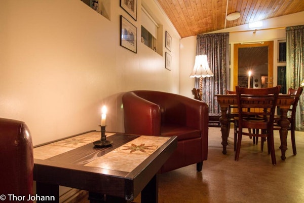 The tables and chair's at Hotel Hjardarbol's lounge makes it a cozy place to stay.