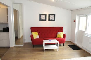 Apartamenty typu studio superior w Rey Apartments oferują komfortową część dzienną, w której goście mogą się zrelaksować i odprężyć.