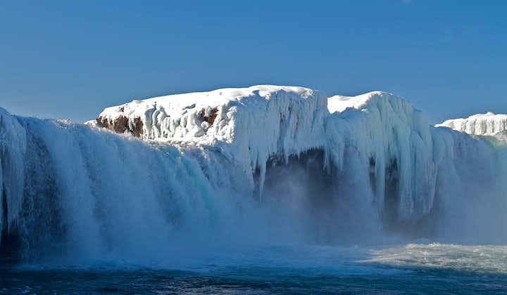 In winter, North Iceland waterfalls are surrounded by ice and snow.