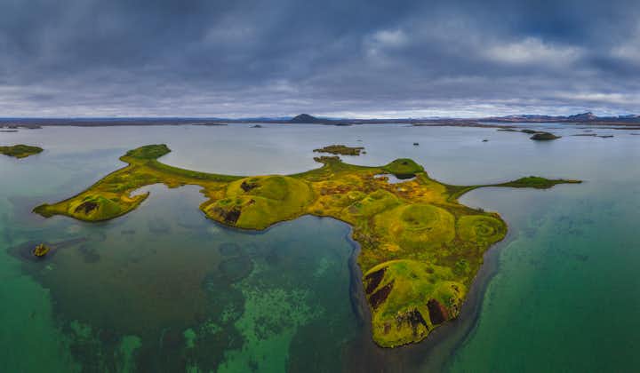 Lake Myvatn features pillars and pseudo craters on its expansive waters.